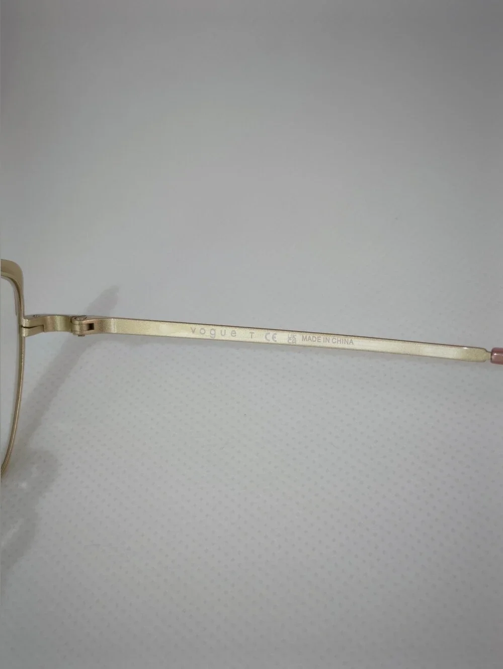 Vogue. Stylish Cat-Eye Metal Frame Glasses in Rose Gold Silk Texture.